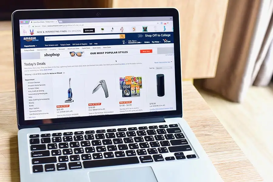 Amazon product listings on laptop screen highlighting product images and online shopping.