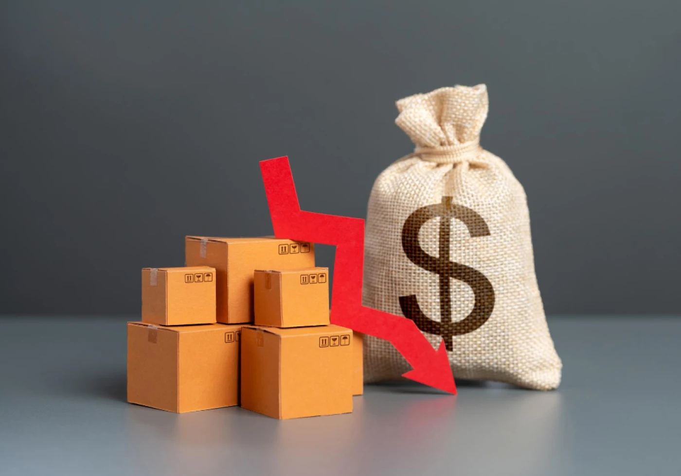 Amazon sales decline concept with falling arrow, product boxes, and money bag.