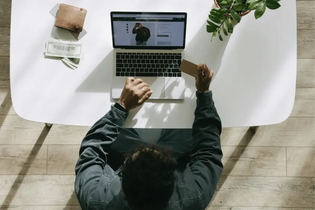 Amazon seller managing products and orders on a laptop.