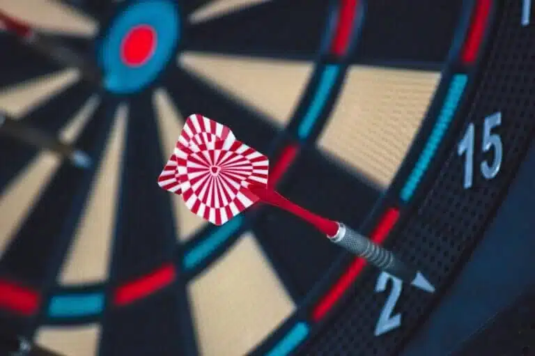 Dart hitting a target board representing focused PPC strategy and campaign goals.