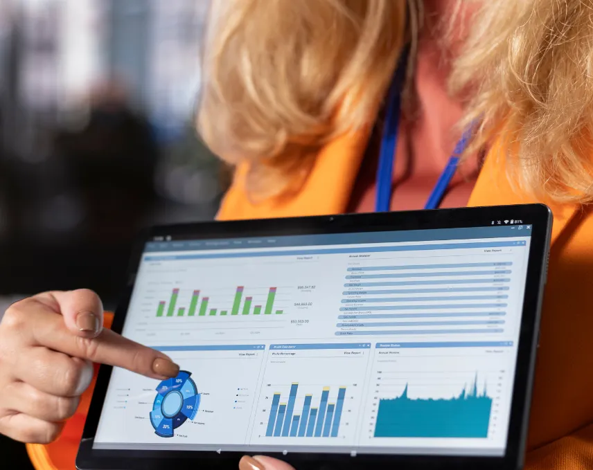 Amazon PPC analytics dashboard displayed on a laptop showing sales and advertising performance data.