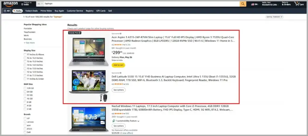 Amazon search results page showing sponsored laptop listings with highlighted ad placements.