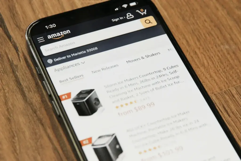Amazon shopping app displayed on a smartphone showing product listings for online sellers.
